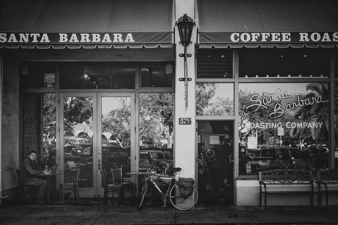 Black and white storefront with coffee roaster signage