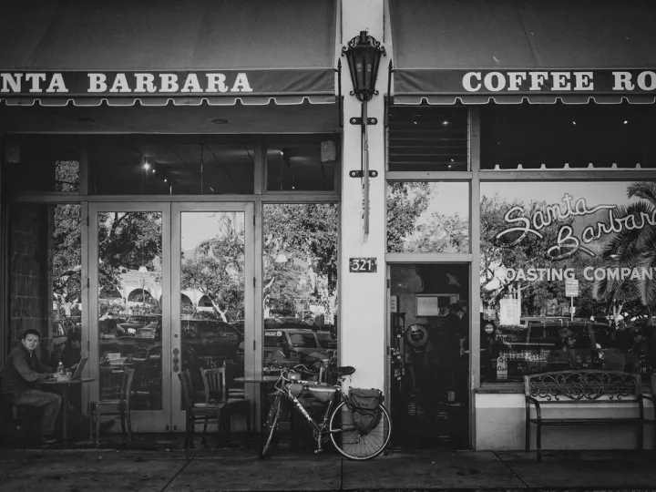 Black and white storefront with coffee roaster signage