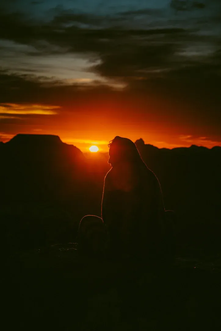 Warm sunset seen through glass with a dark foreground silhouette