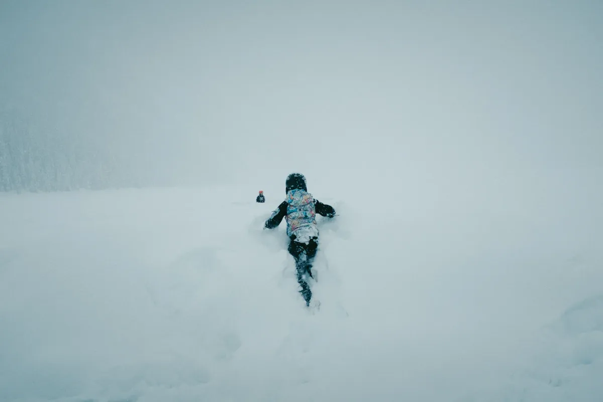 A solitary figure standing in soft fog