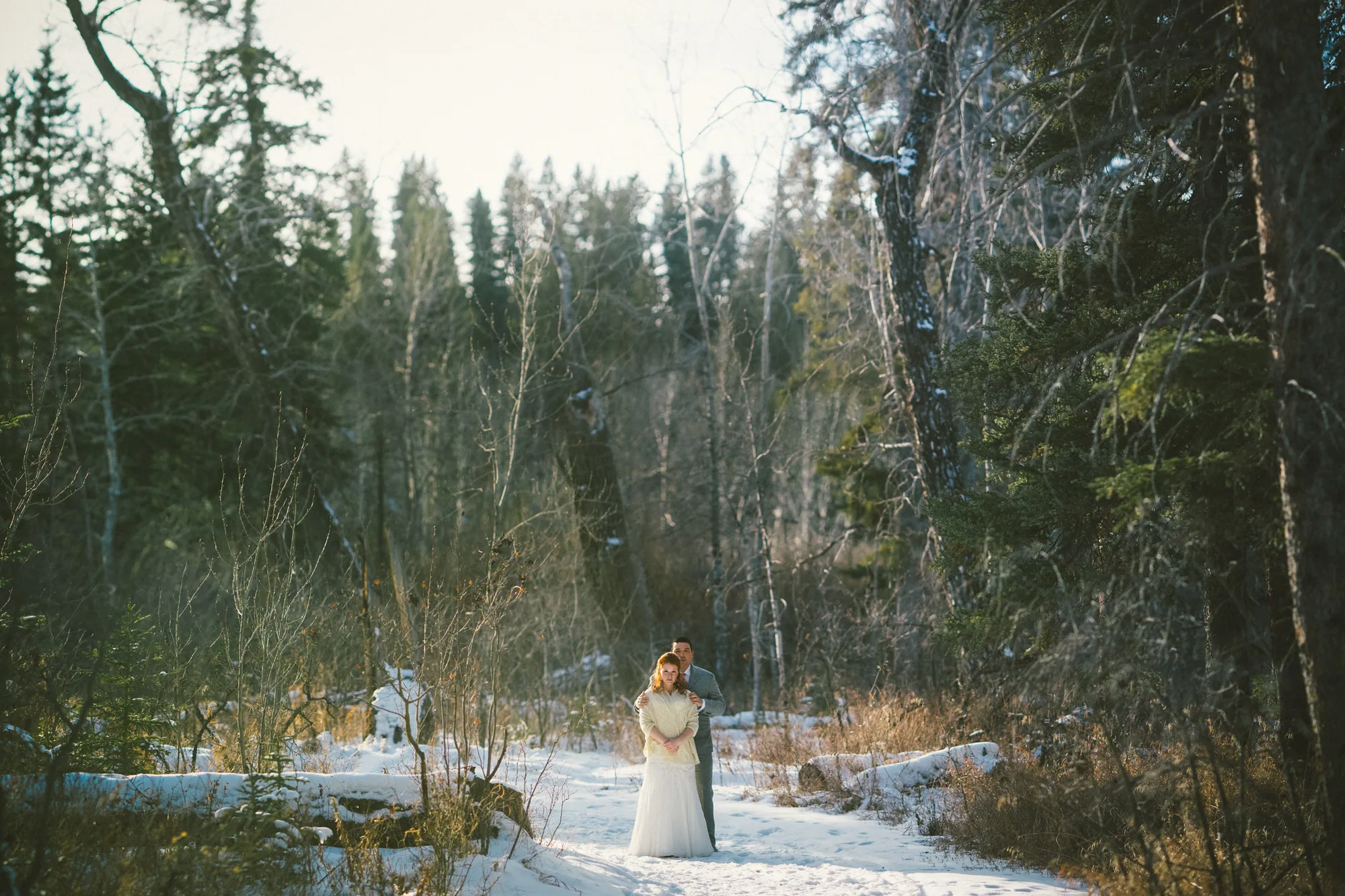 Candid wedding moment photographed outdoors in Alberta
